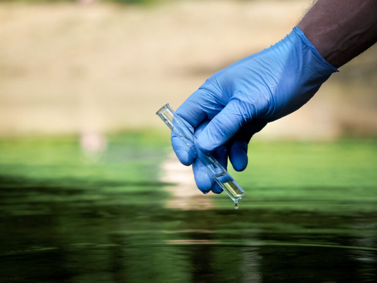 Hand in glove collects water in a test tube